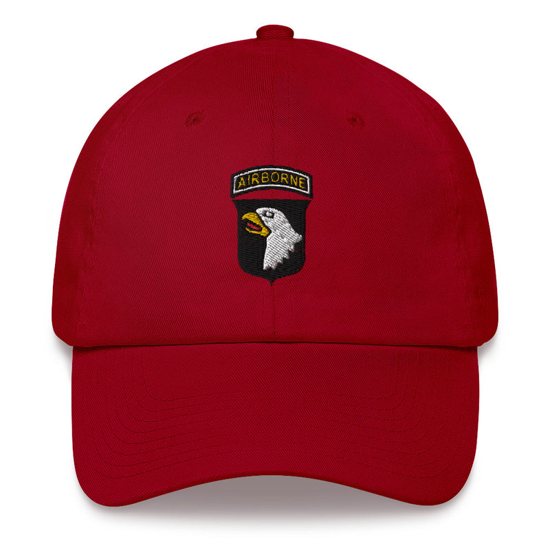 A cranberry colored 101st Airborne Hat with the logo on the front.  The hat has a curved visor and an adjustable strap at the back.