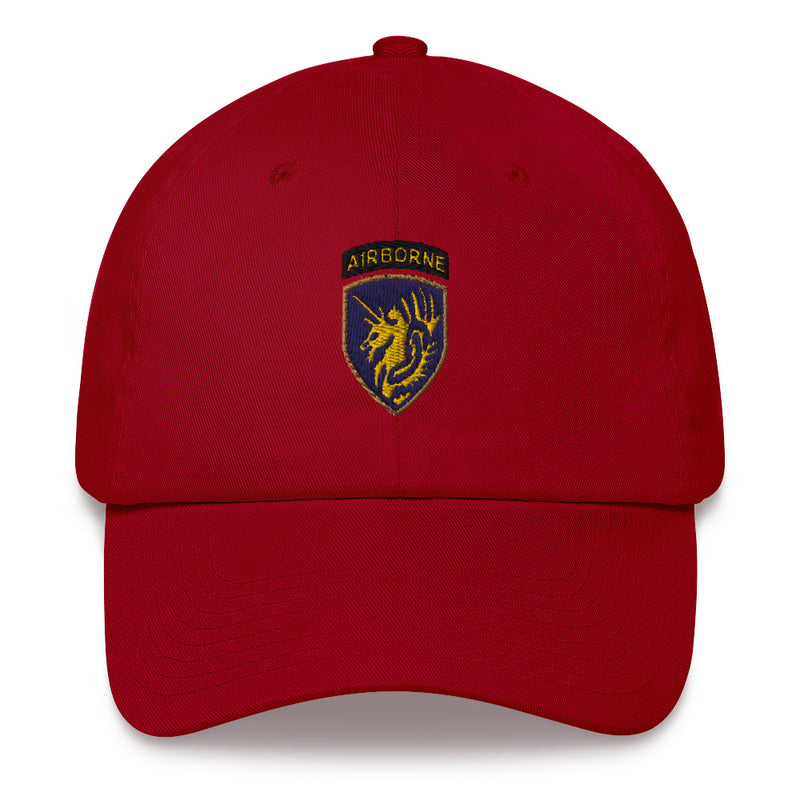A cranberry colored 13th Airborne Division Hat with the logo on the front.  The hat has a curved visor and an adjustable strap at the back.