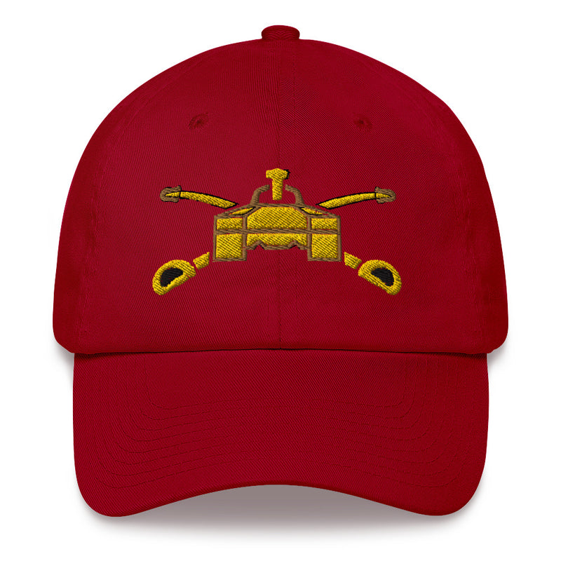 A cranberry colored Army Armor Hat with the logo on the front.  The hat has a curved visor and an adjustable strap at the back.