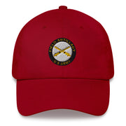A cranberry colored US Army Field Artillery Hat with the logo on the front.  The hat has a curved visor and an adjustable strap at the back.