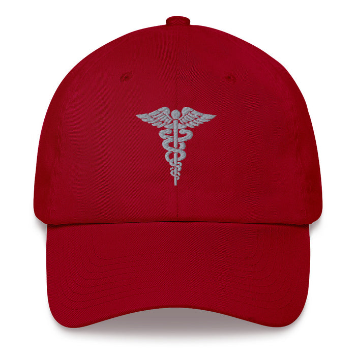 A cranberry colored Hospital Corpsman Hat with the logo on the front.  The hat has a curved visor and an adjustable strap at the back.