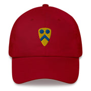 A cranberry colored 2nd Cavalry Division Hat with the logo on the front.  The hat has a curved visor and an adjustable strap at the back.
