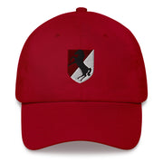 A cranberry colored  11th Armored Cavalry Regiment Hat with the logo on the front.  The hat has a curved visor and an adjustable strap at the back.