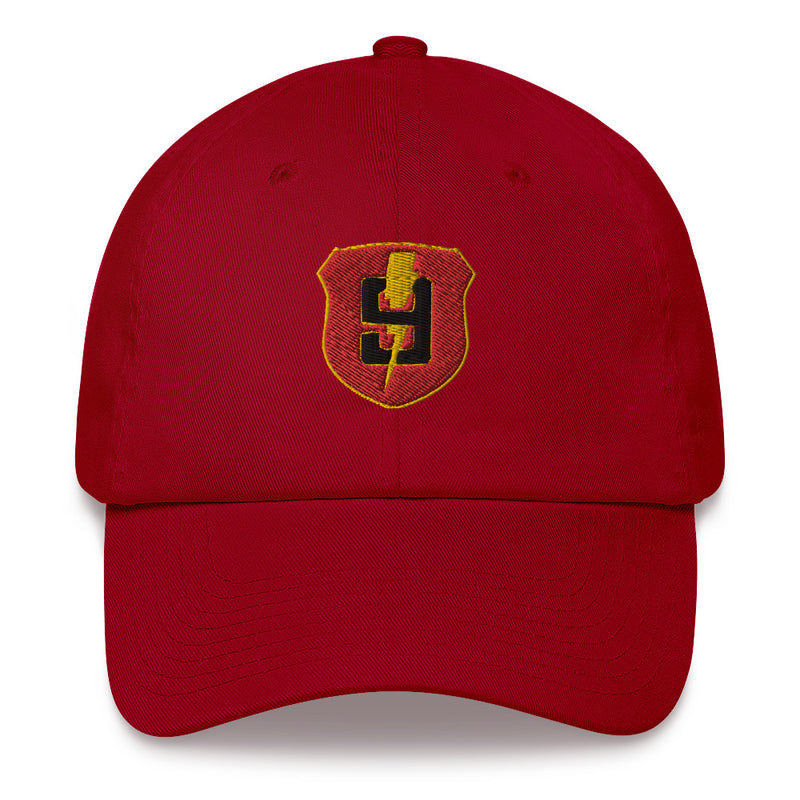 A cranberry colored 9th Regiment Hat with the logo on the front.  The hat has a curved visor and an adjustable strap at the back.