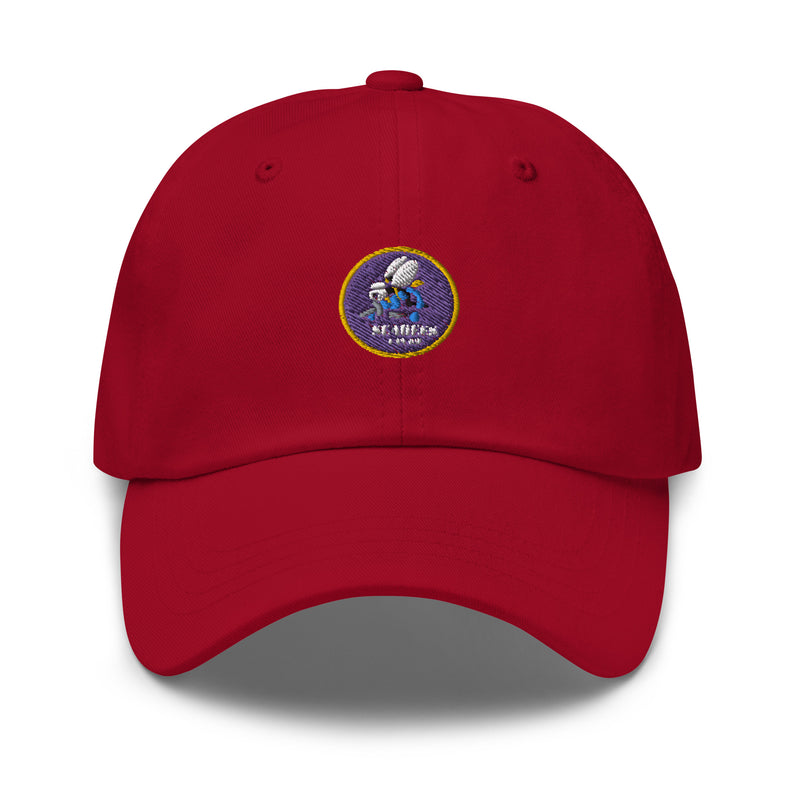 A cranberry colored Navy Seabees Hat with the logo on the front.  The hat has a curved visor and an adjustable strap at the back.