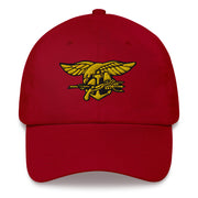 A cranberry colored Navy Seals Hat with the logo on the front.  The hat has a curved visor and an adjustable strap at the back.