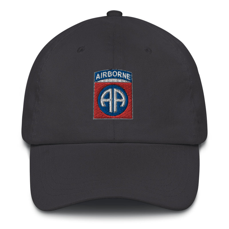 A dark grey 82nd Airborne Hat with the logo on the front.  The hat has a curved visor and an adjustable strap at the back.