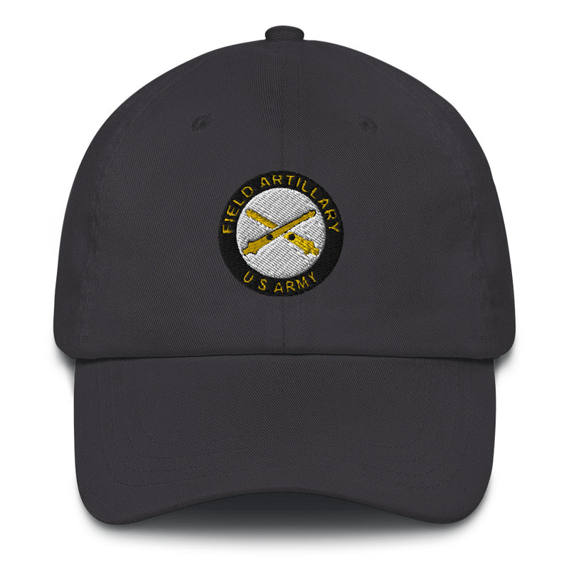 A dark grey US Army Field Artillery Hat with the logo on the front.  The hat has a curved visor and an adjustable strap at the back.