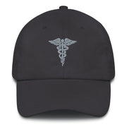 A dark grey Hospital Corpsman Hat with the logo on the front.  The hat has a curved visor and an adjustable strap at the back.