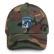 A military style XVIII Airborne Corps Hat with camouflage and the logo on the front.  The hat has a curved visor and an adjustable strap at the back. 