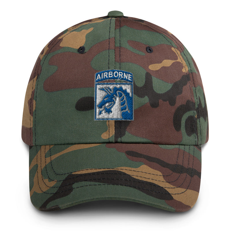 A military style XVIII Airborne Corps Hat with camouflage and the logo on the front.  The hat has a curved visor and an adjustable strap at the back. 