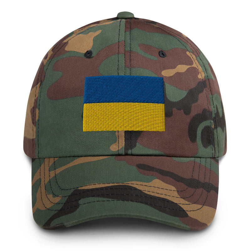 A military style Ukrainian Flag Hat with camouflage and the logo on the front.  The hat has a curved visor and an adjustable strap at the back. 