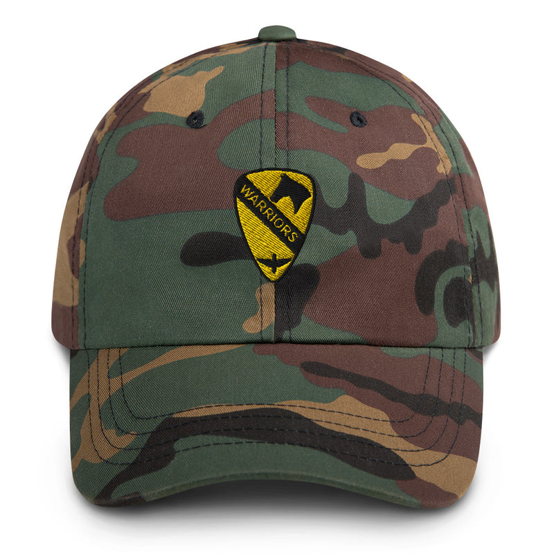 A military style 1st Air Cavalry Brigade Hat with camouflage and the logo on the front.  The hat has a curved visor and an adjustable strap at the back. 