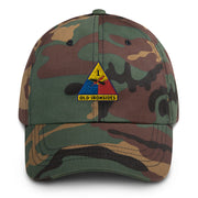A military style 1st Armored Division Hat with camouflage and the logo on the front.  The hat has a curved visor and an adjustable strap at the back. 