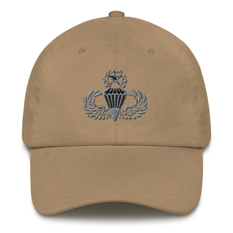 A khaki colored Master Parachutist Hat with the logo on the front.  The hat has a curved visor and an adjustable strap at the back.