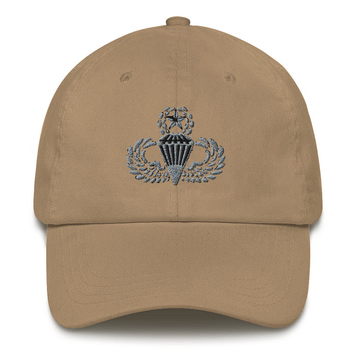 A khaki colored Master Parachutist Hat with the logo on the front.  The hat has a curved visor and an adjustable strap at the back.