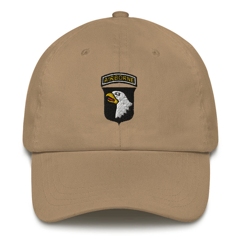 A khaki colored 101st Airborne Hat with the logo on the front.  The hat has a curved visor and an adjustable strap at the back.