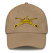 A khaki colored Army Armor Hat with the logo on the front.  The hat has a curved visor and an adjustable strap at the back.