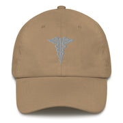 A khaki colored Hospital Corpsman Hat with the logo on the front.  The hat has a curved visor and an adjustable strap at the back.