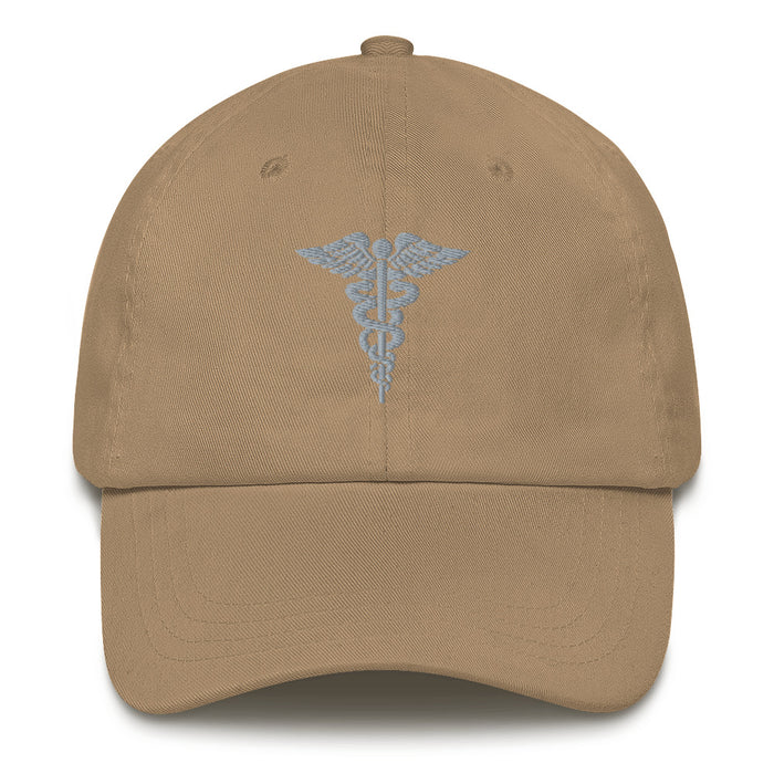 A khaki colored Hospital Corpsman Hat with the logo on the front.  The hat has a curved visor and an adjustable strap at the back.