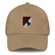 A khaki colored 11th Armored Cavalry Regiment Hat with the logo on the front.  The hat has a curved visor and an adjustable strap at the back.