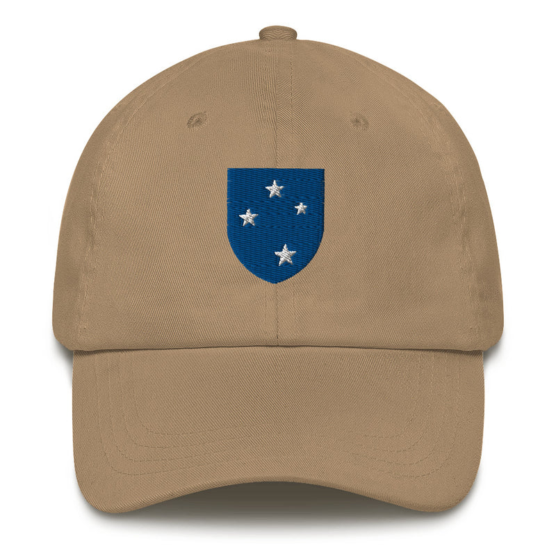 A khaki colored 23rd Infantry Division Hat with the logo on the front.  The hat has a curved visor and an adjustable strap at the back.