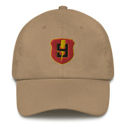 A khaki colored 9th Regiment Hat with the logo on the front.  The hat has a curved visor and an adjustable strap at the back.