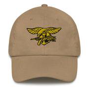 A khaki colored Navy Seals Hat with the logo on the front.  The hat has a curved visor and an adjustable strap at the back.