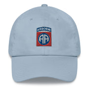 A light blue 82nd Airborne Hat with the logo on the front.  The hat has a curved visor and an adjustable strap at the back.