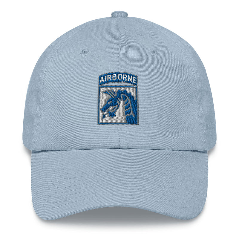 A light blue XVIII Airborne Corps Hat with the logo on the front.  The hat has a curved visor and an adjustable strap at the back.