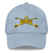 A light blue Army Armor Hat with the logo on the front.  The hat has a curved visor and an adjustable strap at the back.