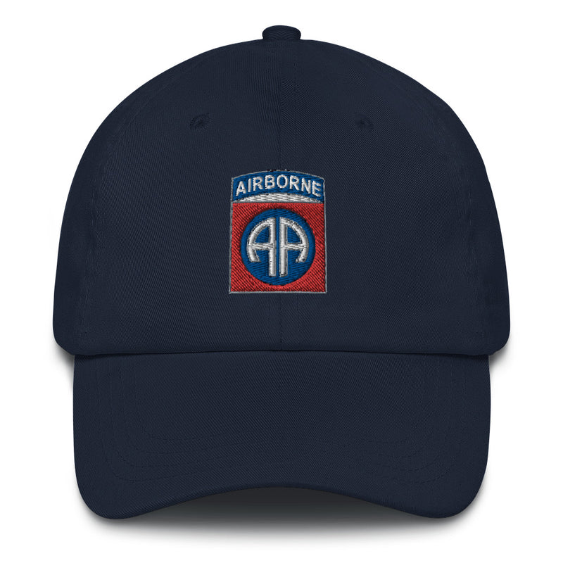 A navy blue 82nd Airborne Hat with the logo on the front.  The hat has a curved visor and an adjustable strap at the back.