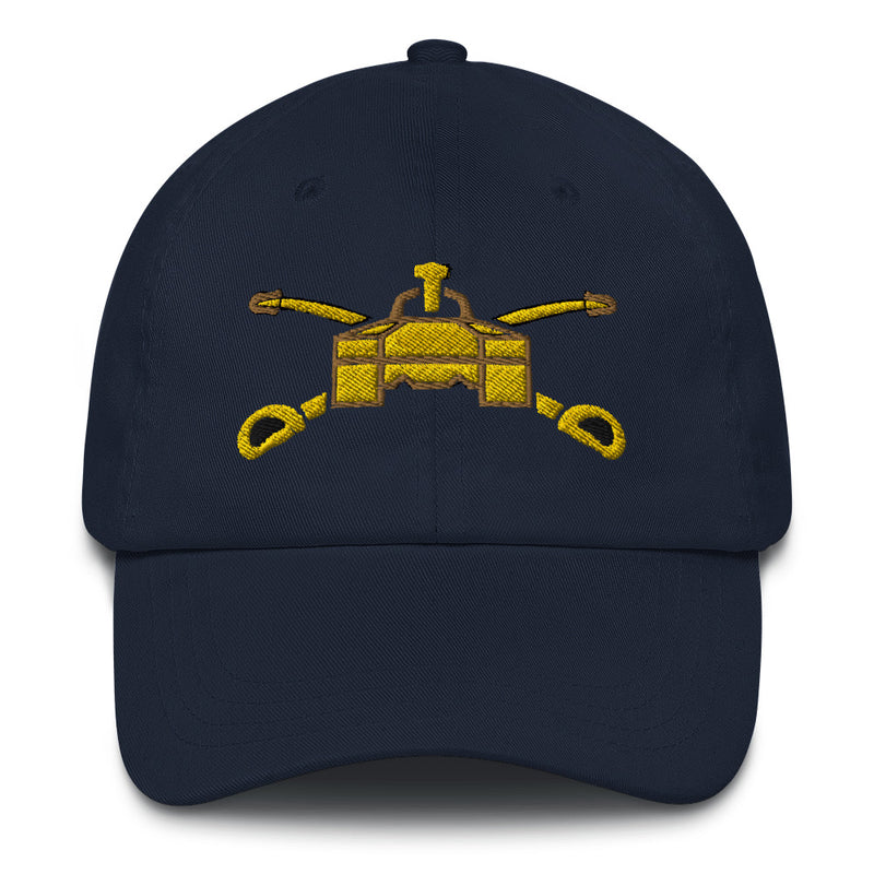 A navy blue Army Armor Hat with the logo on the front.  The hat has a curved visor and an adjustable strap at the back.