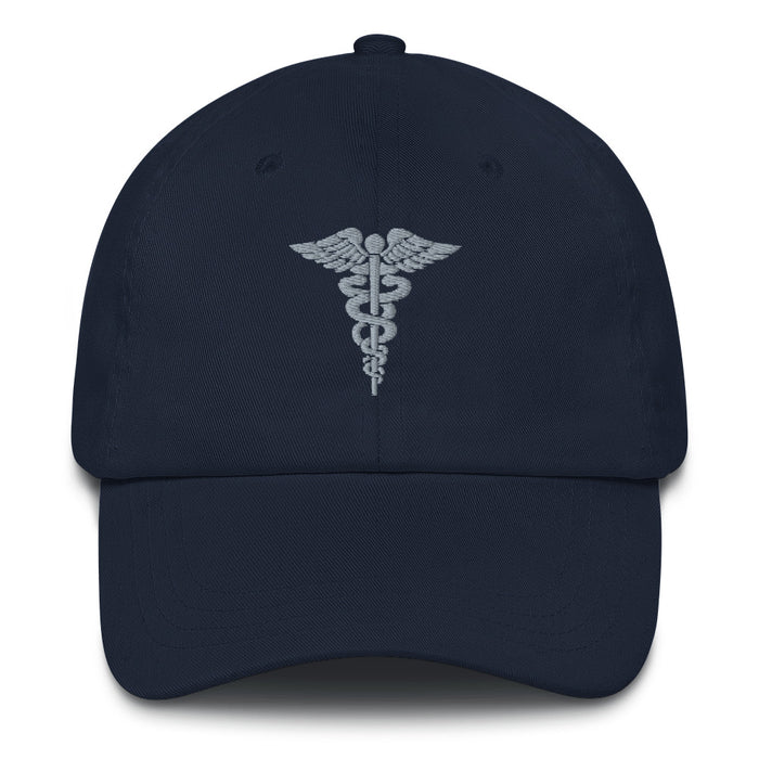 A navy blue Hospital Corpsman Hat with the logo on the front.  The hat has a curved visor and an adjustable strap at the back.