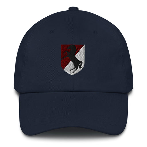 A navy 11th Armored Cavalry Regiment Hat with the logo on the front.  The hat has a curved visor and an adjustable strap at the back.