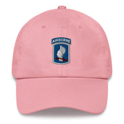 A pink 173rd Airborne Brigade Hat with the logo on the front.  The hat has a curved visor and an adjustable strap at the back.