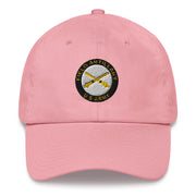 A pink US Army Field Artillery Hat with the logo on the front.  The hat has a curved visor and an adjustable strap at the back.