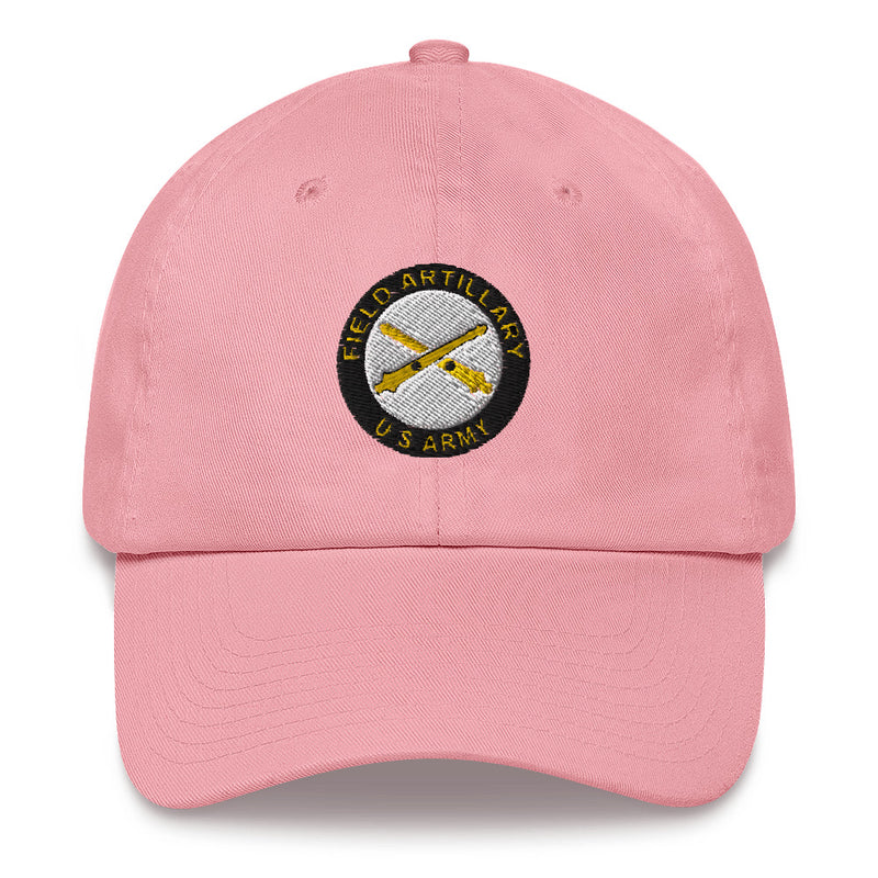 A pink US Army Field Artillery Hat with the logo on the front.  The hat has a curved visor and an adjustable strap at the back.