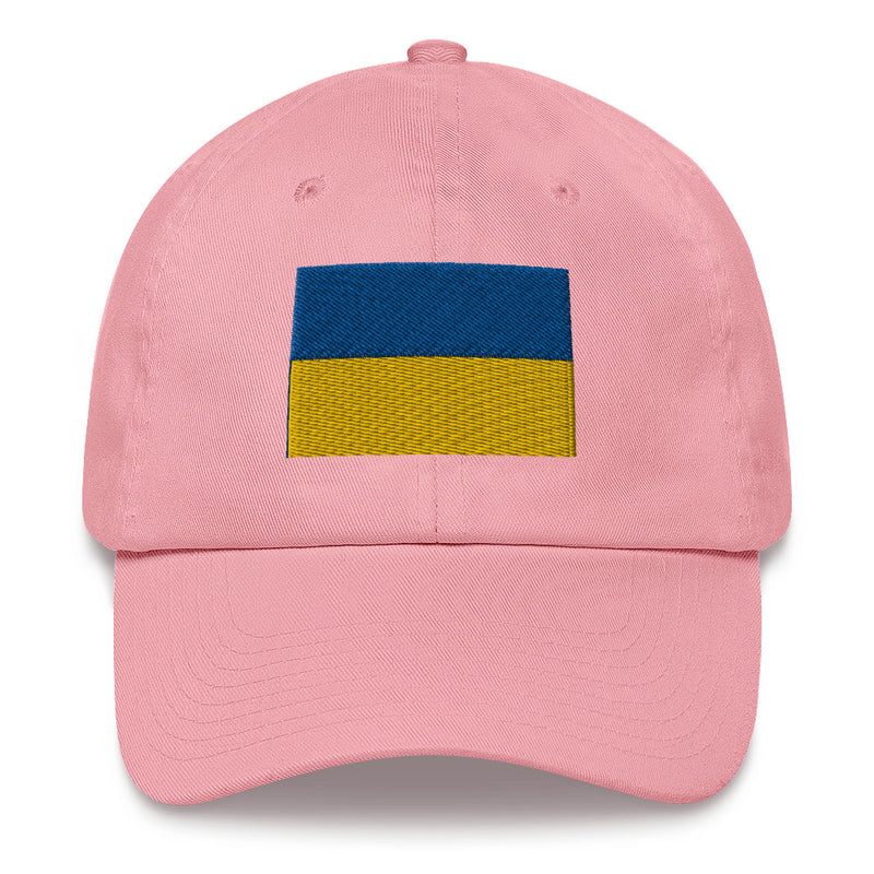 A pink Ukrainian Flag Hat with the logo on the front.  The hat has a curved visor and an adjustable strap at the back.