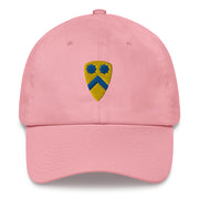 A pink 2nd Cavalry Division Hat with the logo on the front.  The hat has a curved visor and an adjustable strap at the back.