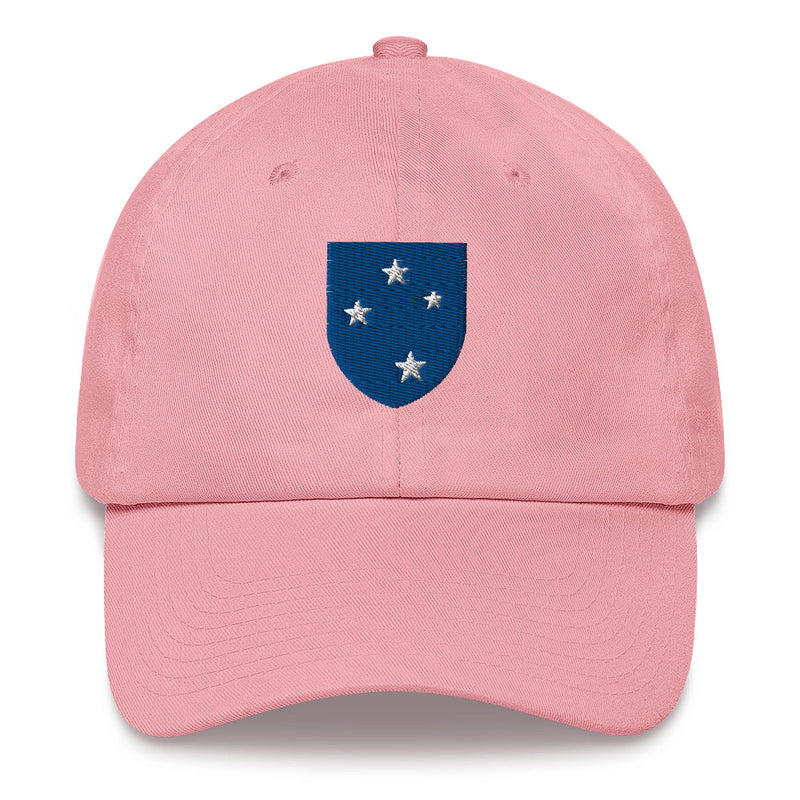 A pink 23rd Infantry Division Hat with the logo on the front.  The hat has a curved visor and an adjustable strap at the back.
