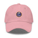 A pink Navy Seabees Hat with the logo on the front.  The hat has a curved visor and an adjustable strap at the back.