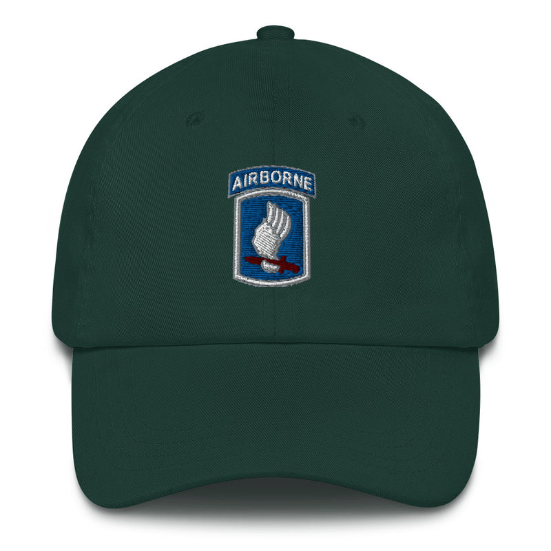 A spruce colored 173rd Airborne Brigade Hat with the logo on the front.  The hat has a curved visor and an adjustable strap at the back.