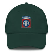 A spruce colored 82nd Airborne Hat with the logo on the front.  The hat has a curved visor and an adjustable strap at the back.