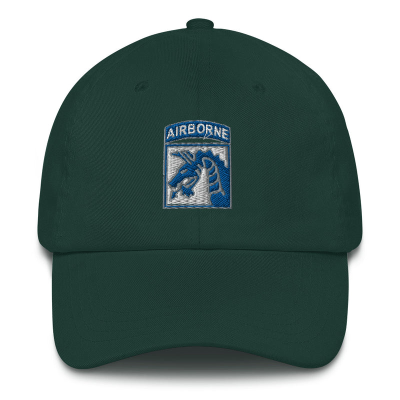 A spruce colored XVIII Airborne Corps Hat with the logo on the front.  The hat has a curved visor and an adjustable strap at the back.