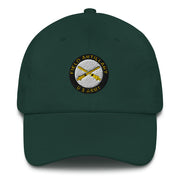 A spruce colored US Army Field Artillery Hat with the logo on the front.  The hat has a curved visor and an adjustable strap at the back.