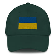 A spruce colored Ukrainian Flag Hat with the logo on the front.  The hat has a curved visor and an adjustable strap at the back.