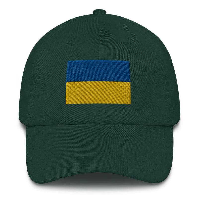 A spruce colored Ukrainian Flag Hat with the logo on the front.  The hat has a curved visor and an adjustable strap at the back.
