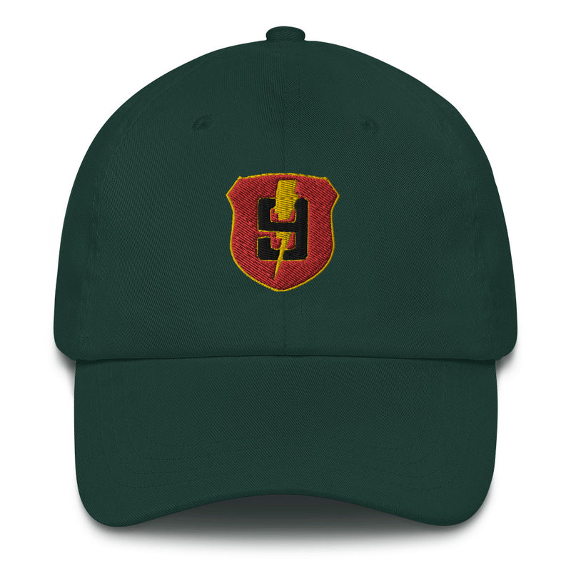A spruce colored 9th Regiment Hat with the logo on the front.  The hat has a curved visor and an adjustable strap at the back.