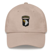 A stone colored 101st Airborne Hat with the logo on the front.  The hat has a curved visor and an adjustable strap at the back.